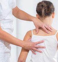 Chiropractic Doctor Adjusts Elementary Girl